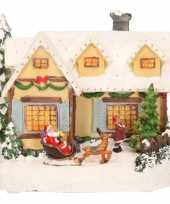 Kerstdorp geel kersthuisje met kerstman 19 cm